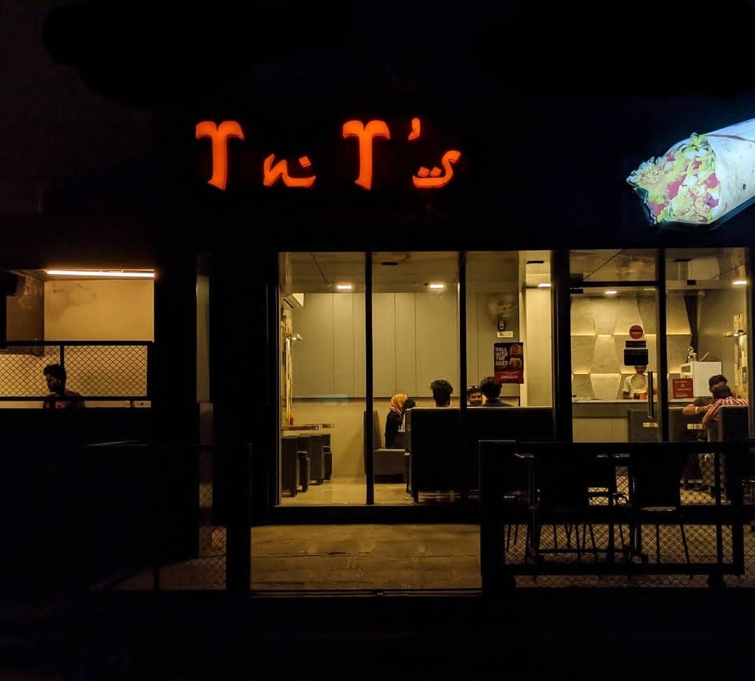 TnT's restaurant exterior in Solapur at night